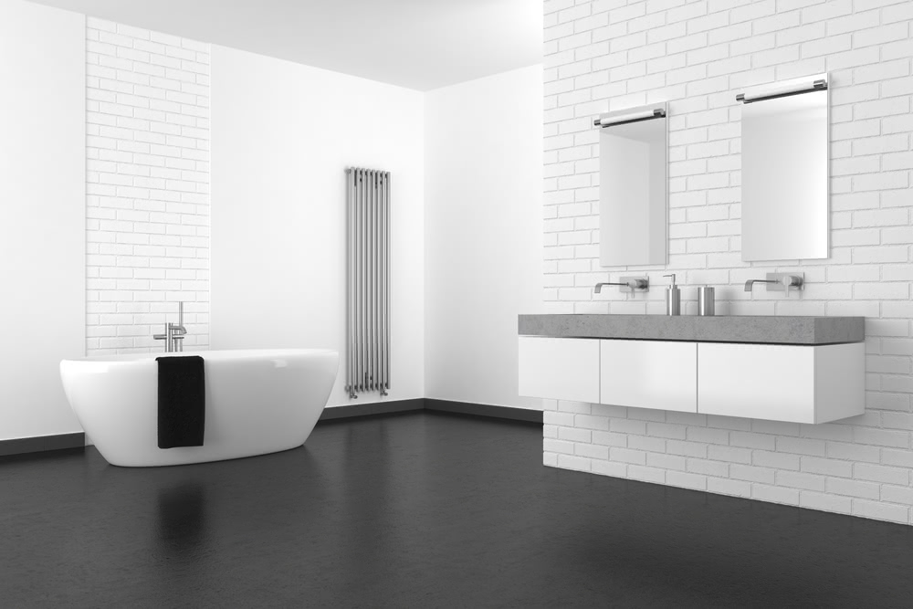 Come impiegare la resina epossidica in casa? 3 Immagine di bagno con pavimento scuro